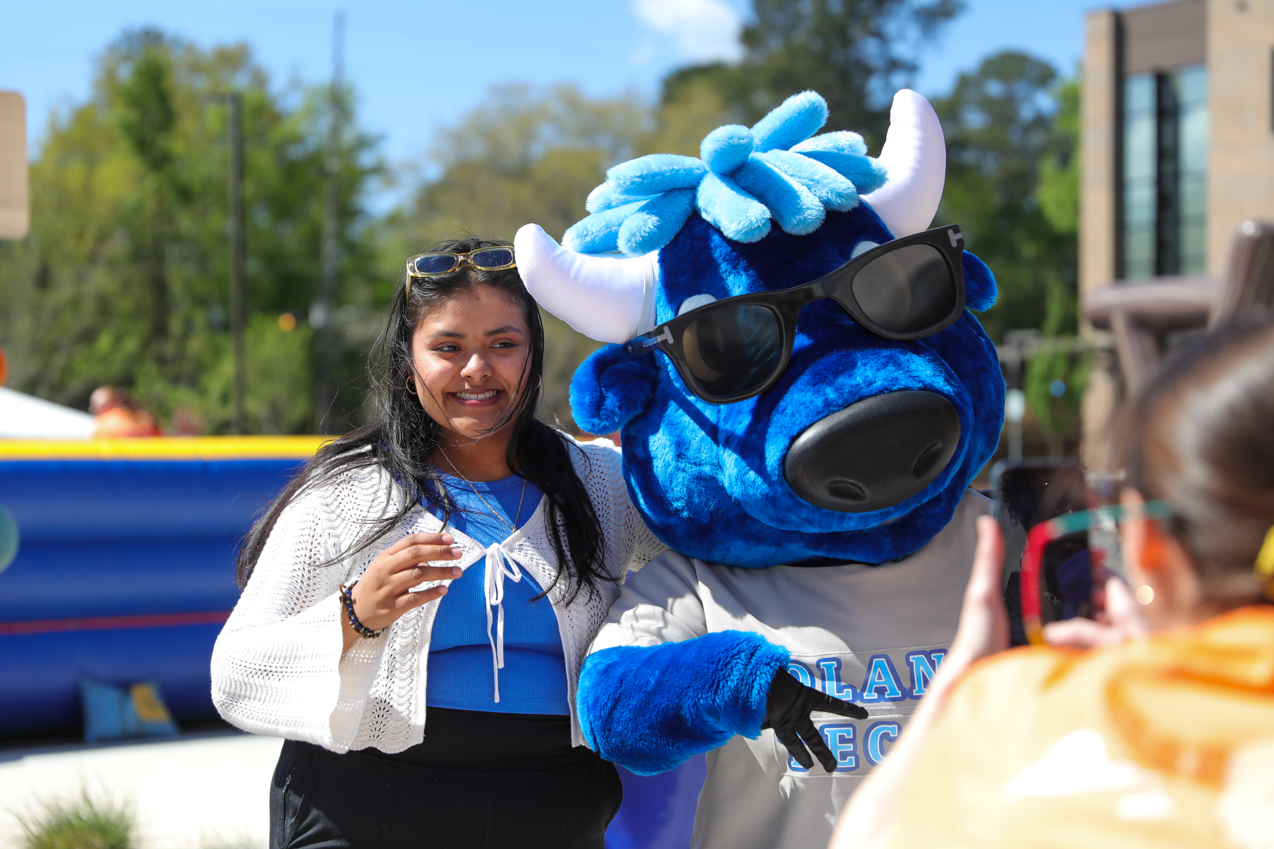 Mav posing with a student on campus at Thunderfest.