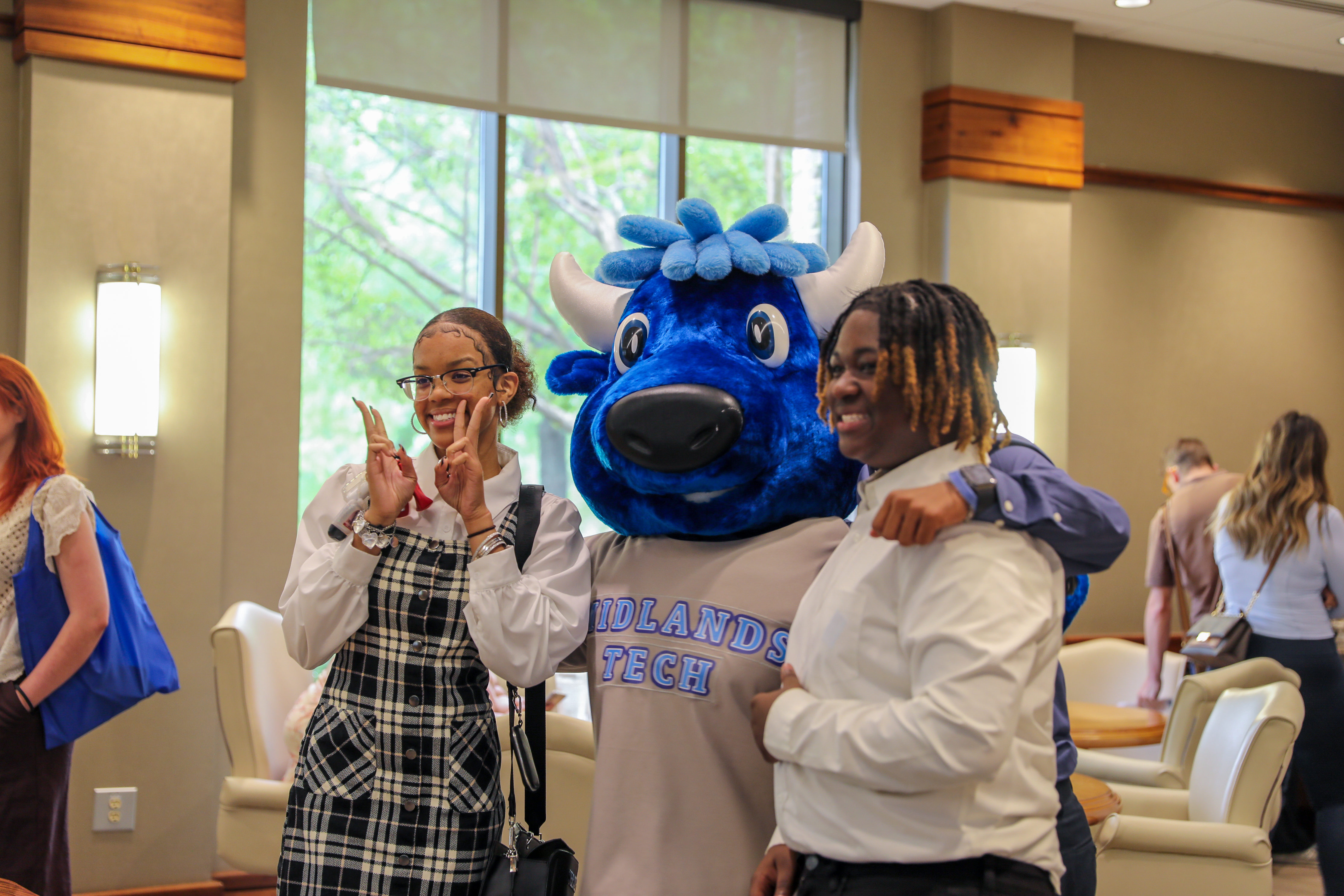 Mav the mascot with MTC students on campus.