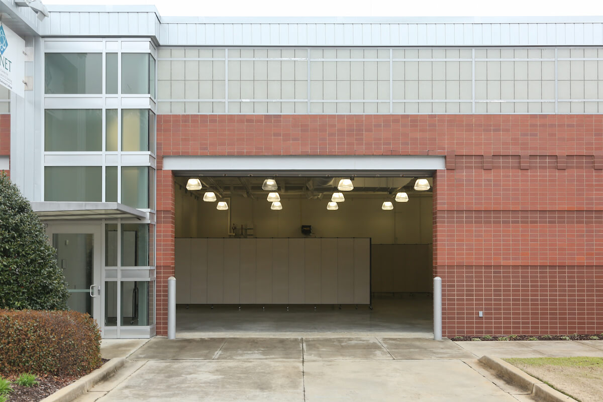 Exterior of Business Accelerator bay with rolling door open.