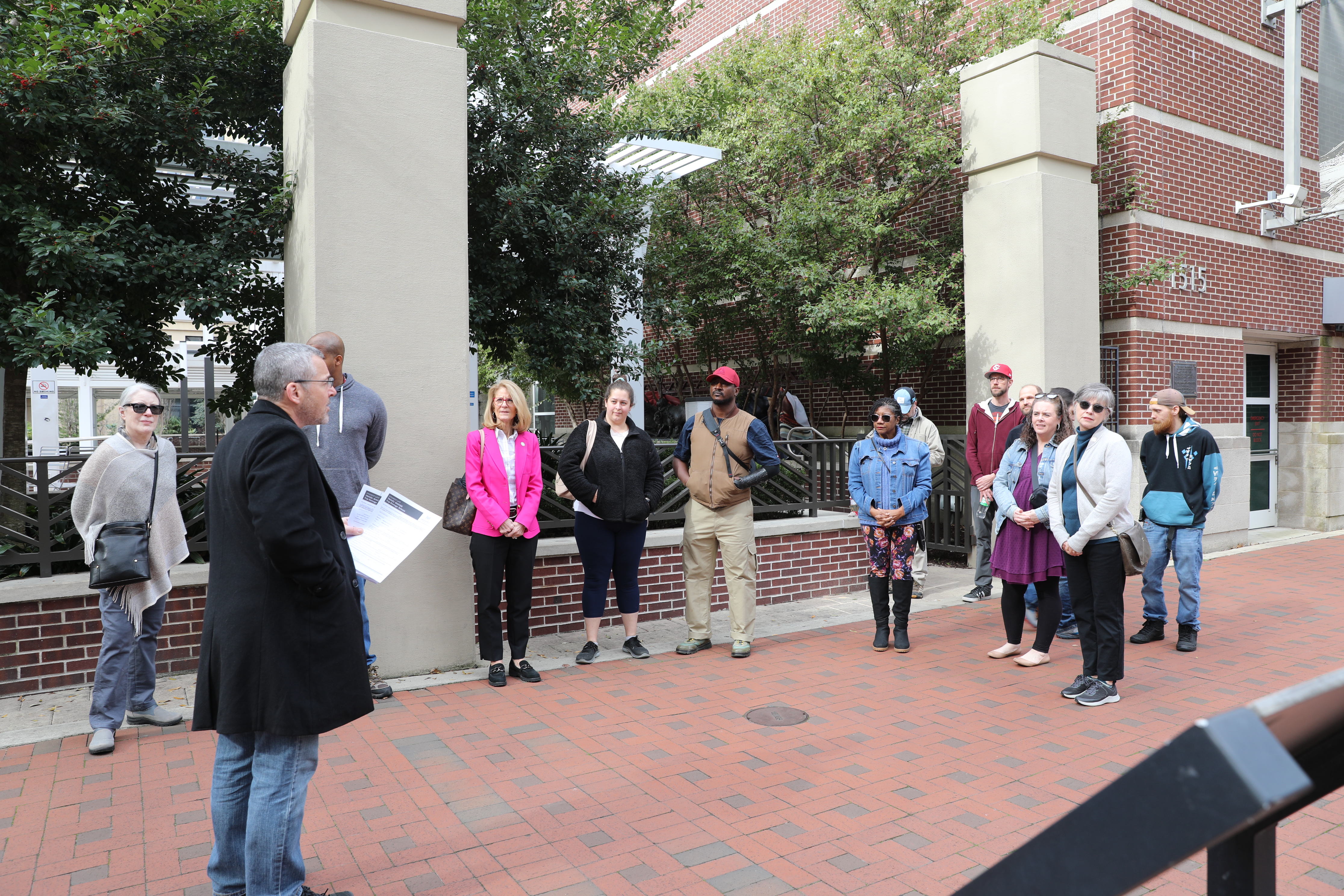 Dr. Scotti talks with the walking tour participants.