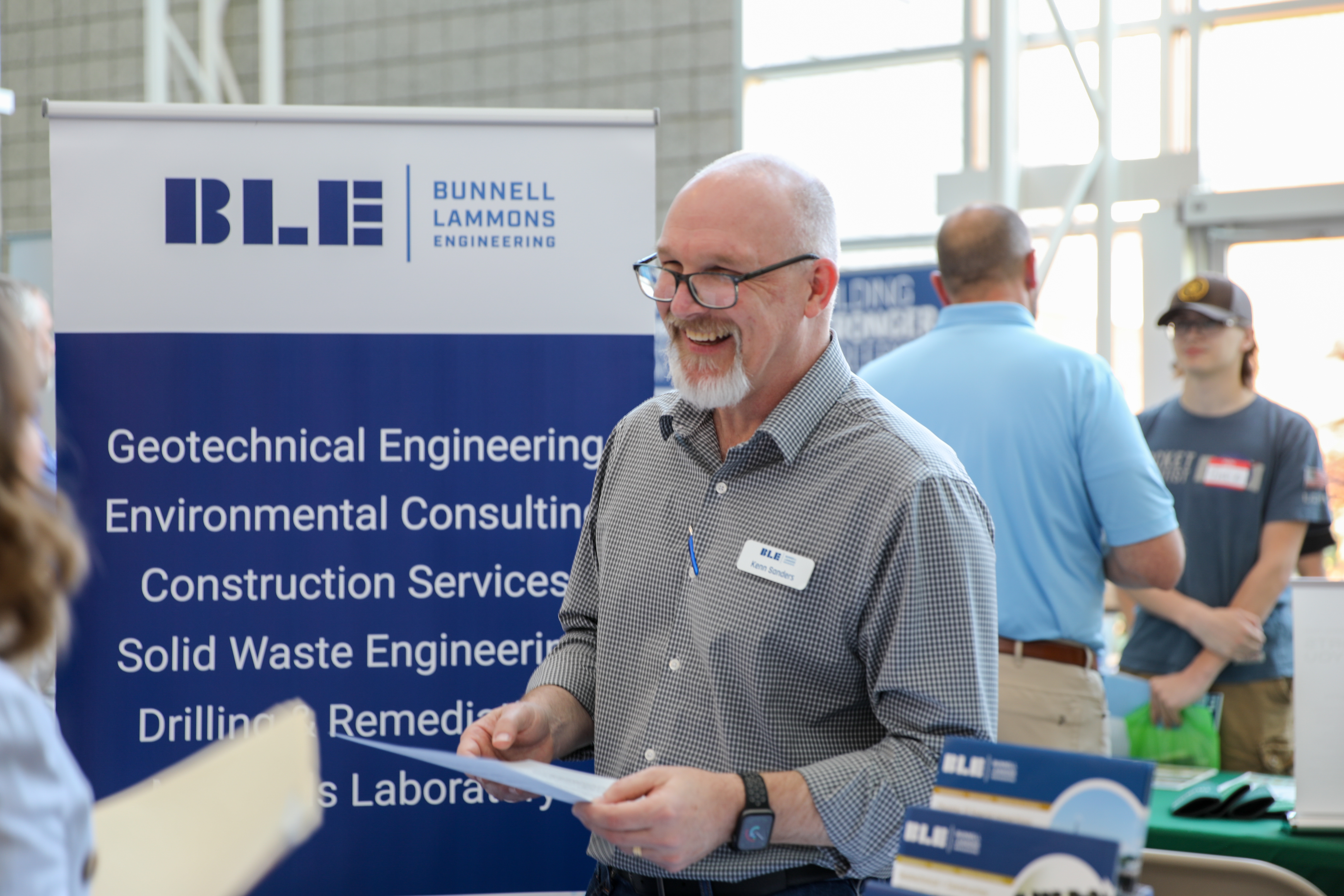 Person smiling at an MTC student at the 2024 Engineering Expo