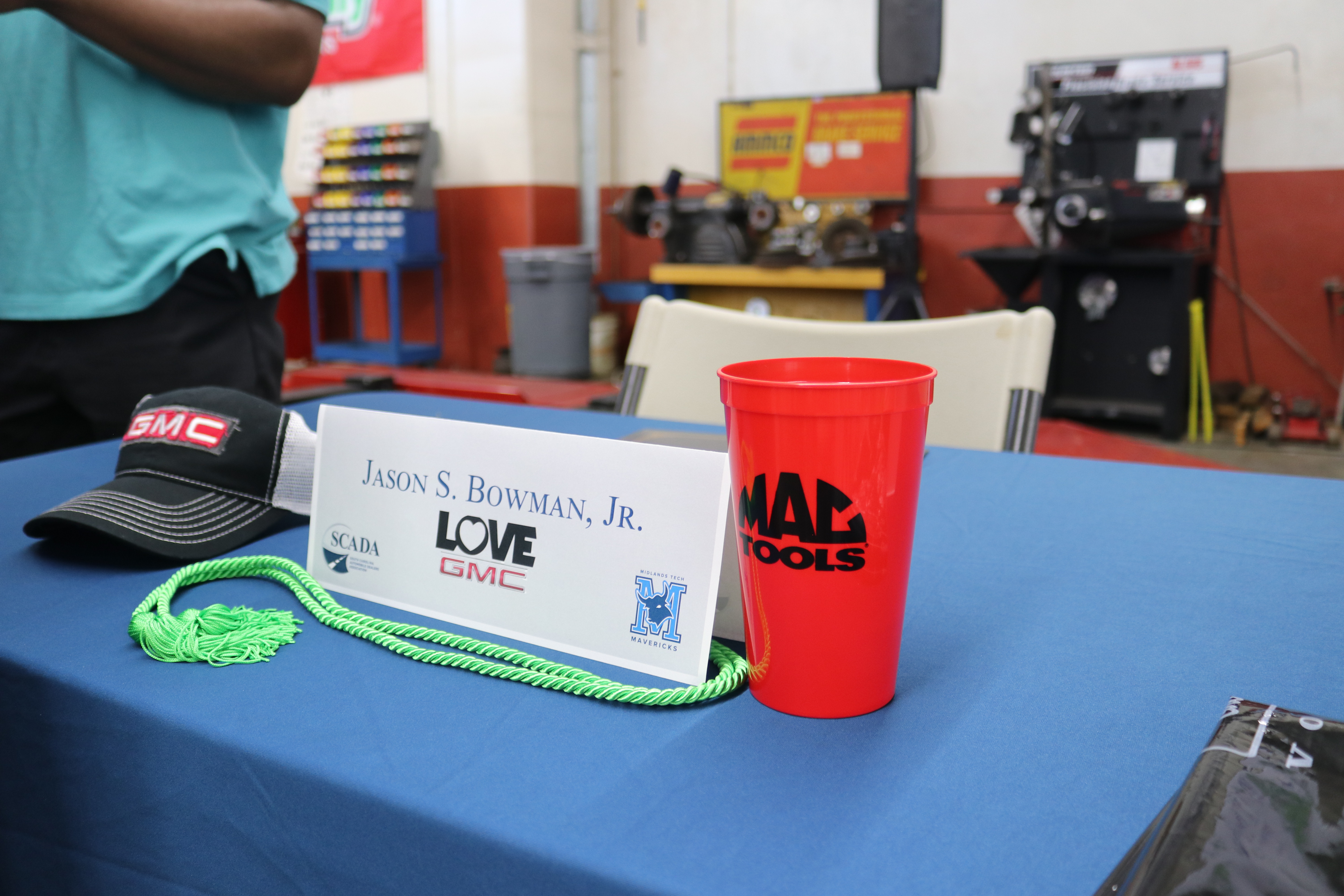 Image of an apprentice's nameplate along with swag given to each apprentice during the signing ceremony.