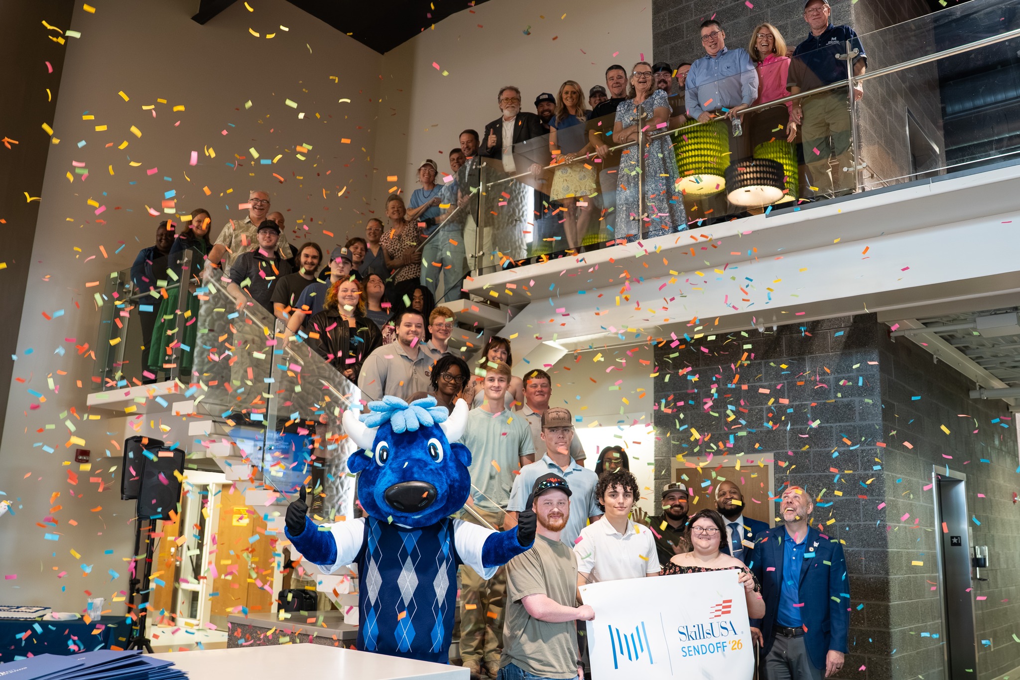 SkillsUSA students and leadership with Mav as confetti falls