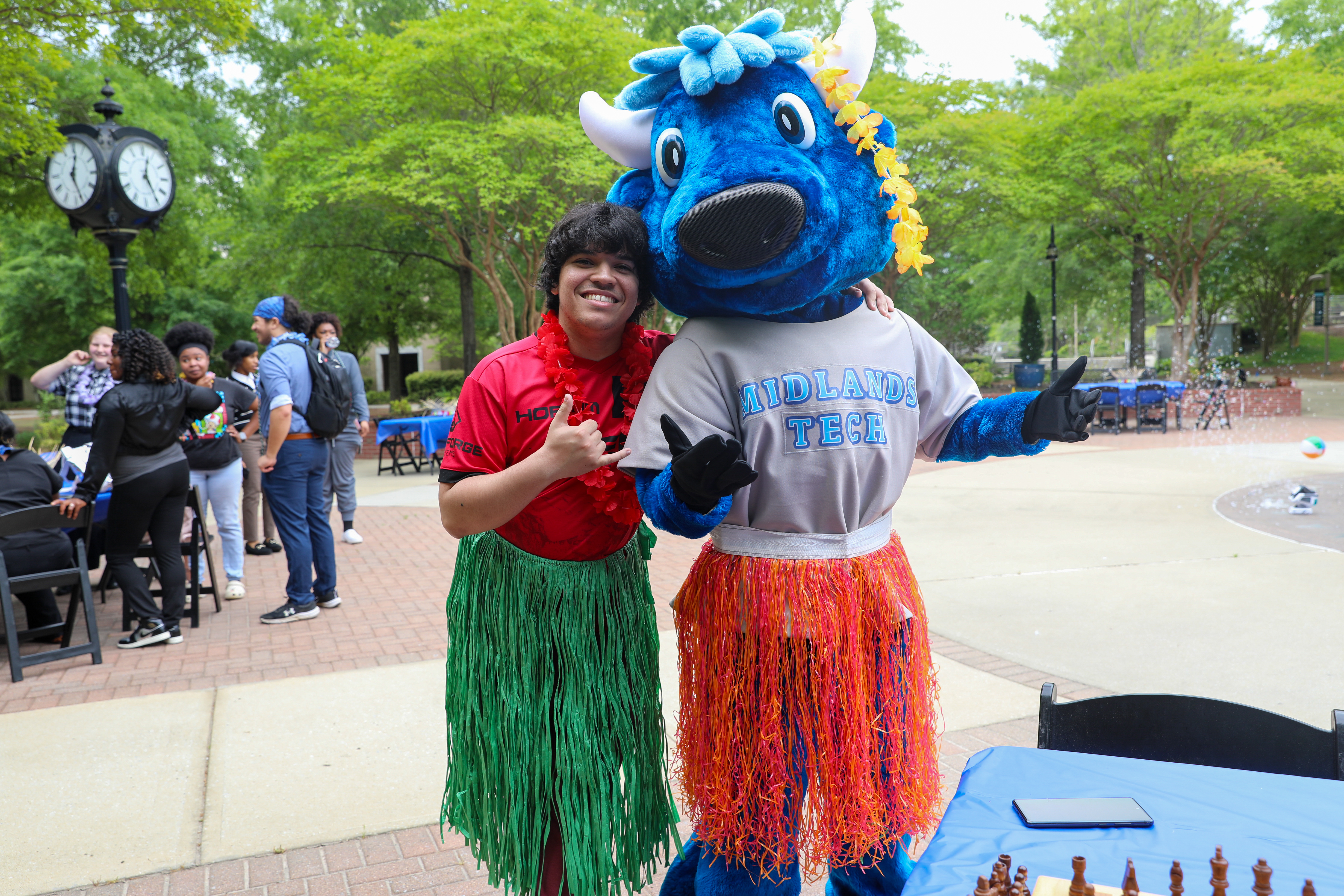 Mav the MTC Mascot posing with a student at a student life event.