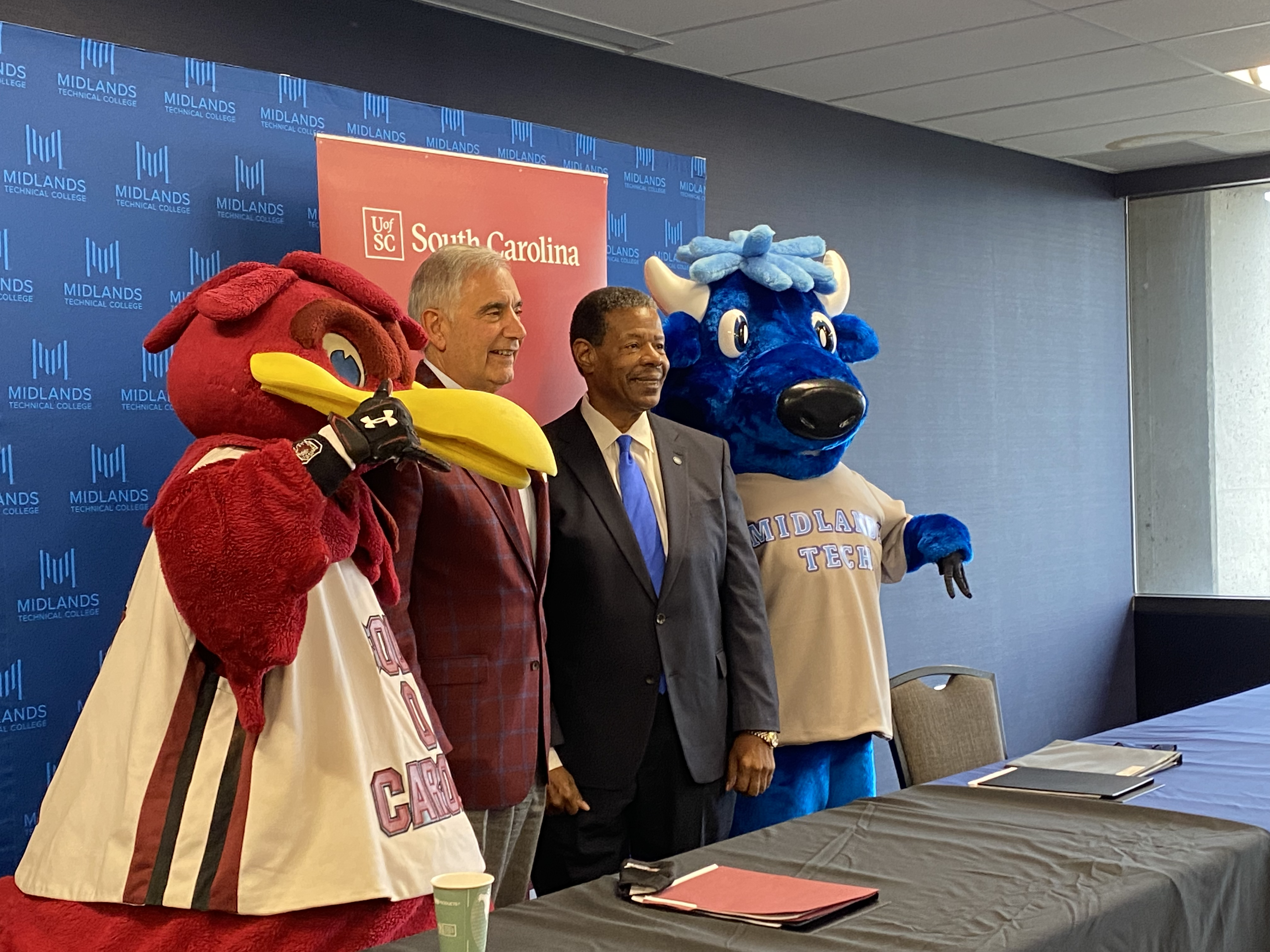 Cocky, UofSC President Pastides, MTC President Rhames, and Mav