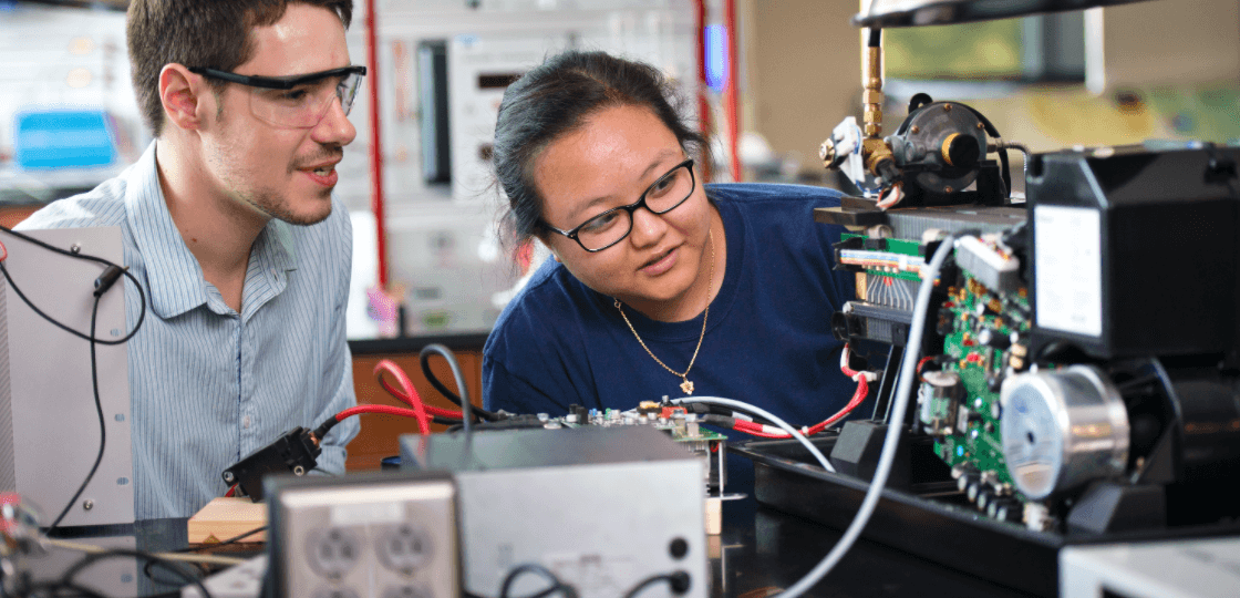 student working with a professor