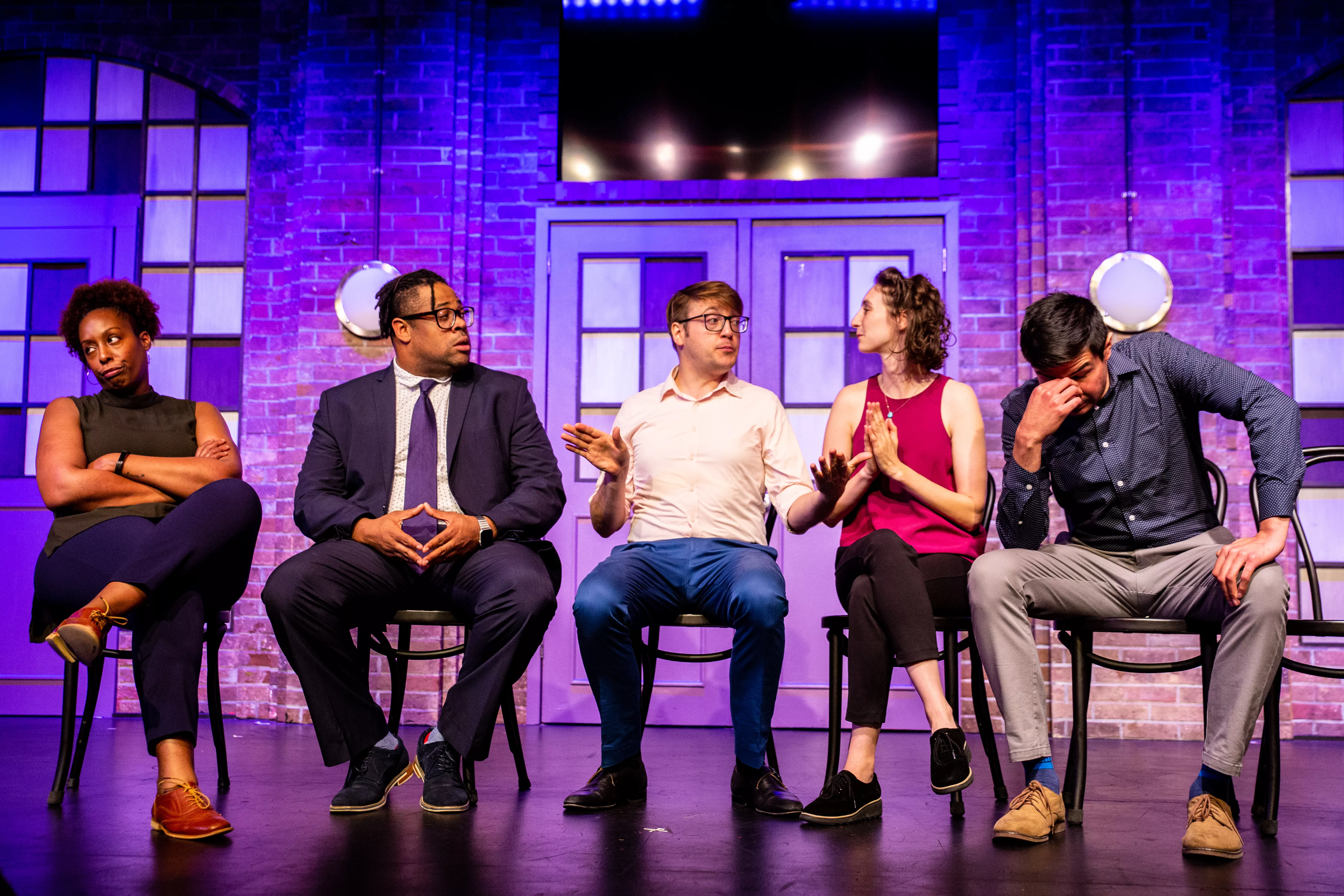 Image of Second City cast on stage