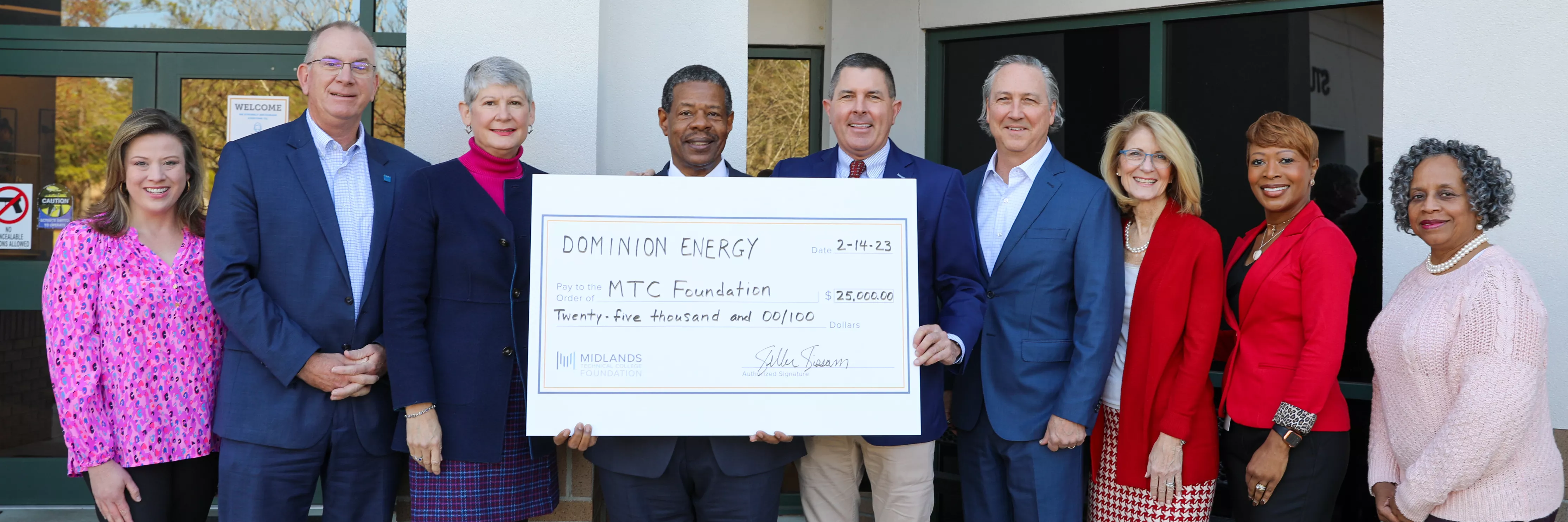 Image of Dominion Energy representatives presenting a $25,000 check to Midlands Technical College leadership.
