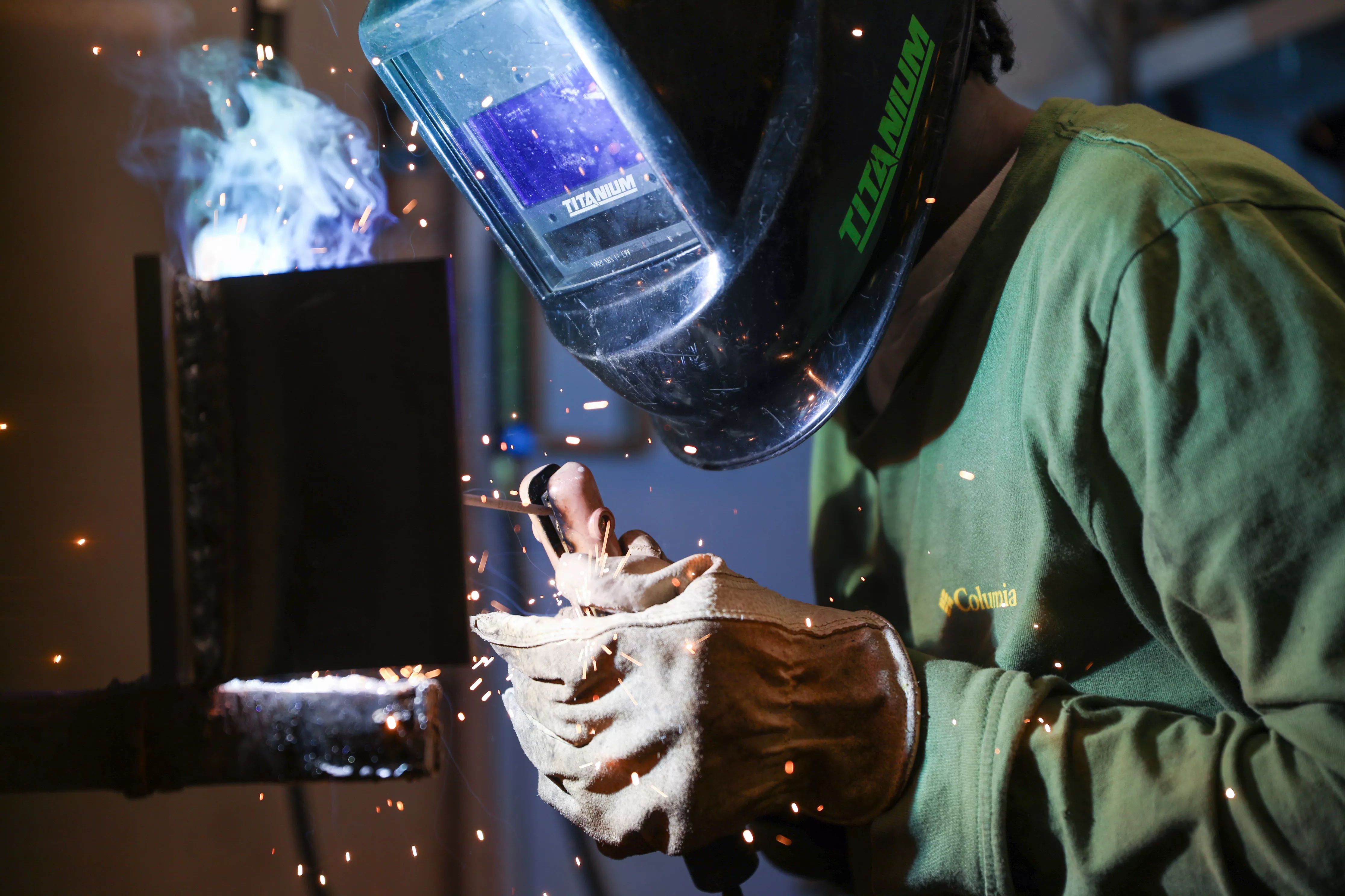 Image of a student participating in the high school welding competition.