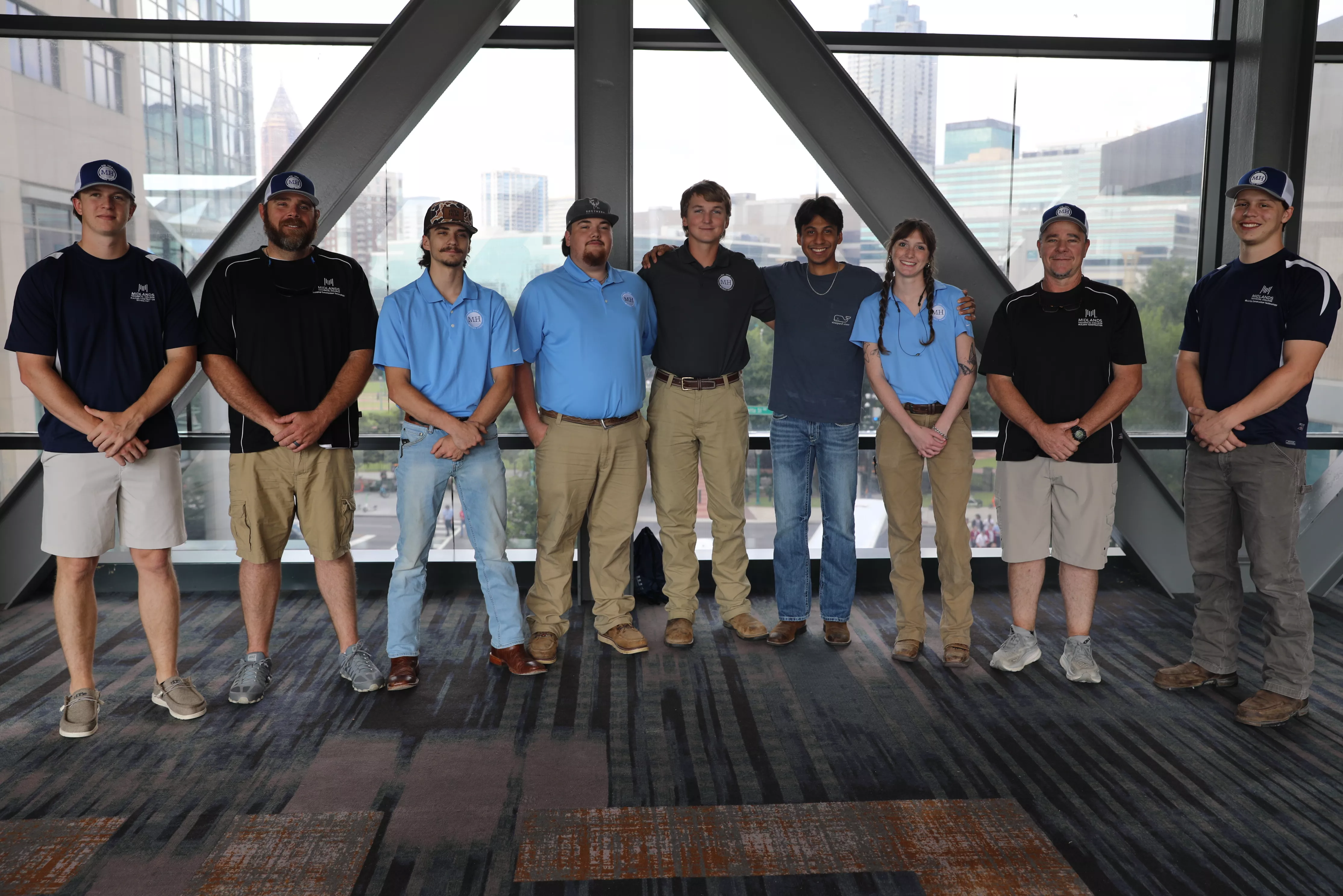 Building Construction Technology students who won silver at SkillsUSA national skills competition standing with faculty.