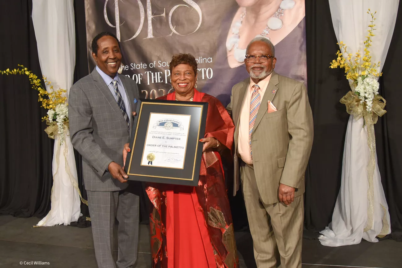 Diane Sumpter is presented the Order of the Palmetto plaque.