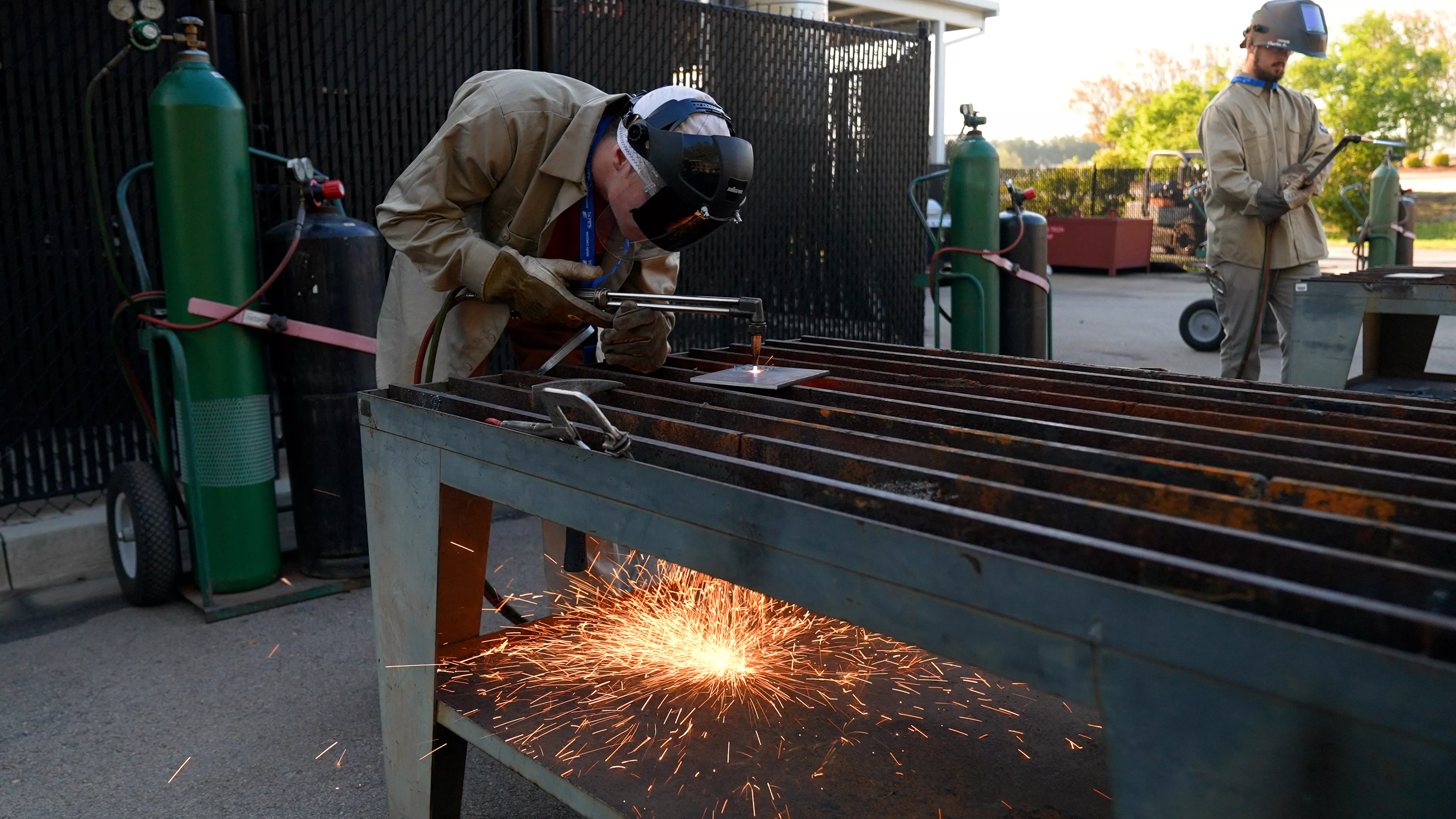 Welder with a settling torch heating up metal