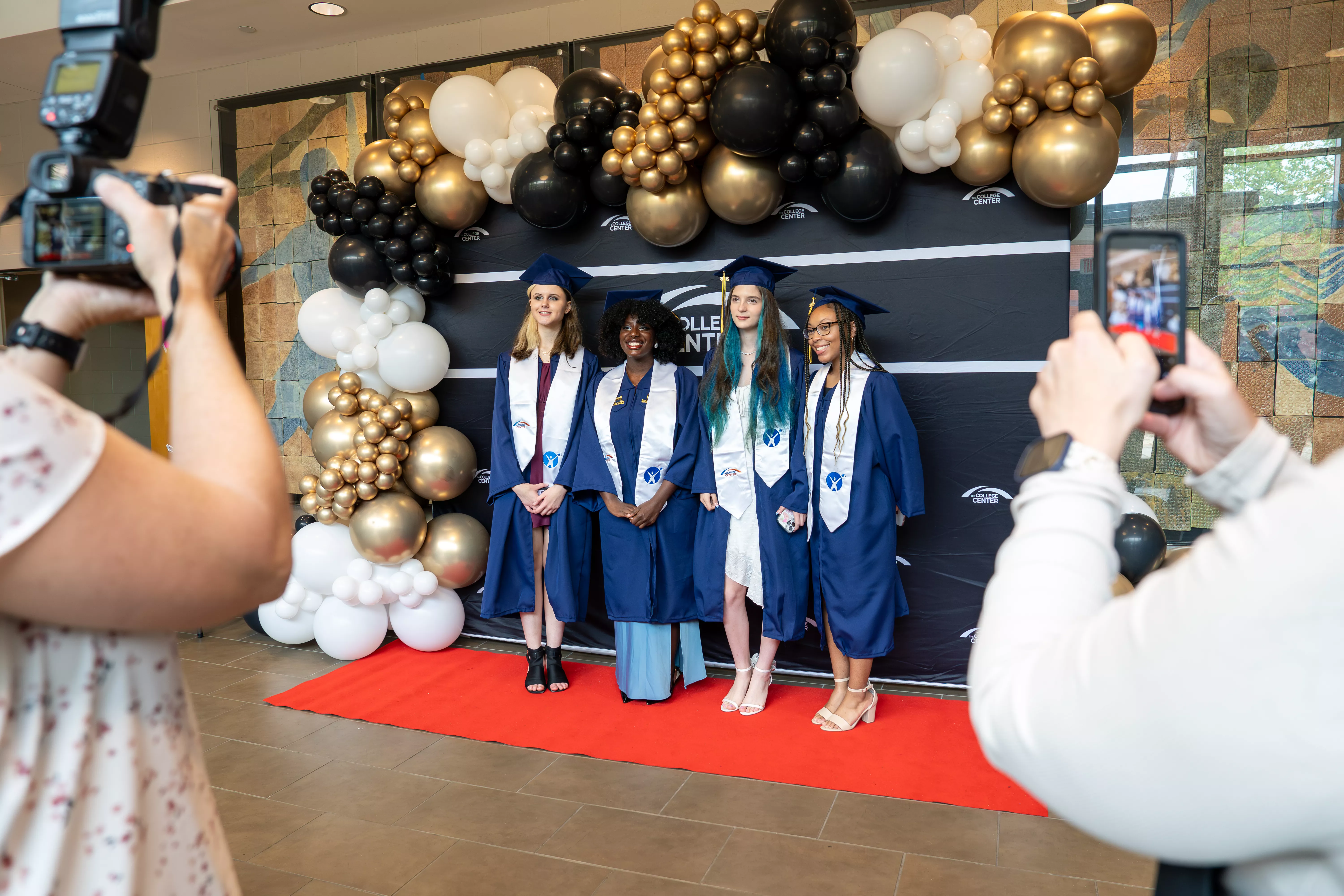 Graduates from The College Center's class of 2026 having their pictures taken.