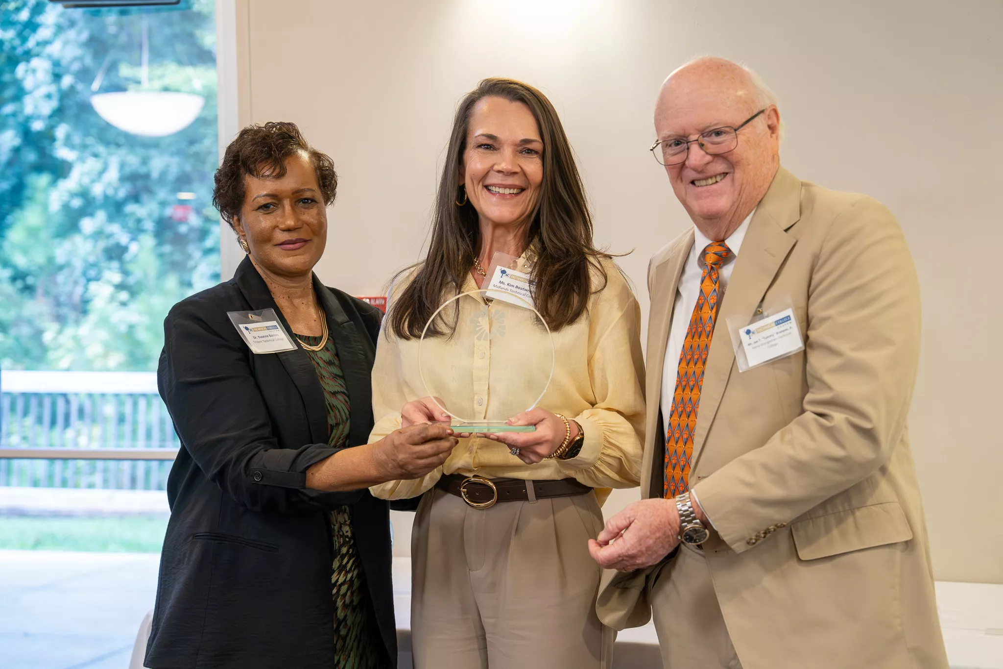Kim Boatwright holding her award. 