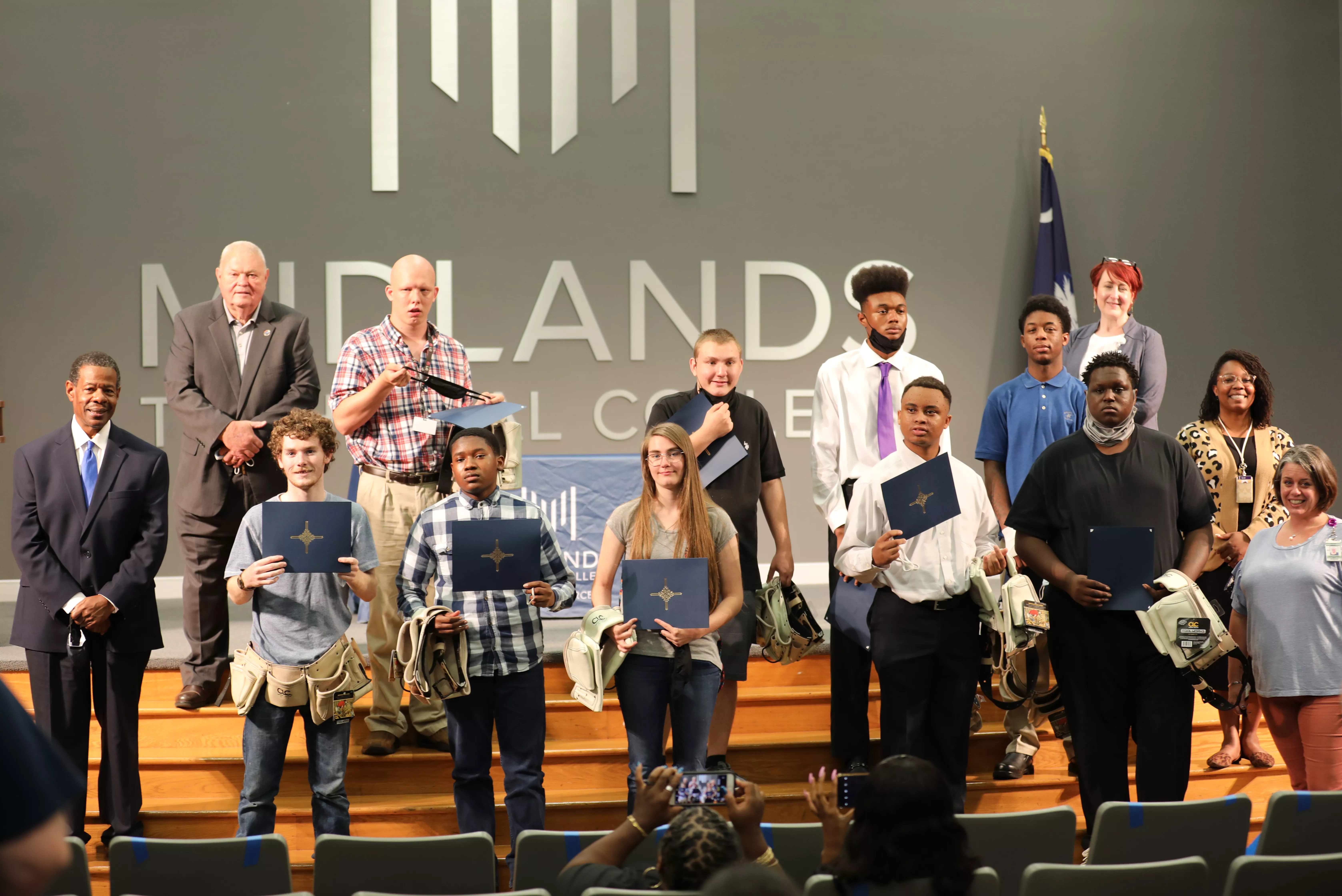 MTC President Rhames and Commissioner Knotts with BOOM graduates and teachers on June 1, 2021